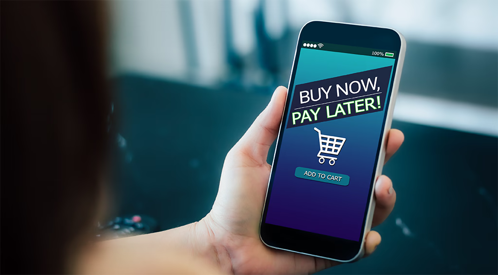 Shopper using a mobile app to select Buy Now Pay Later at an online checkout.